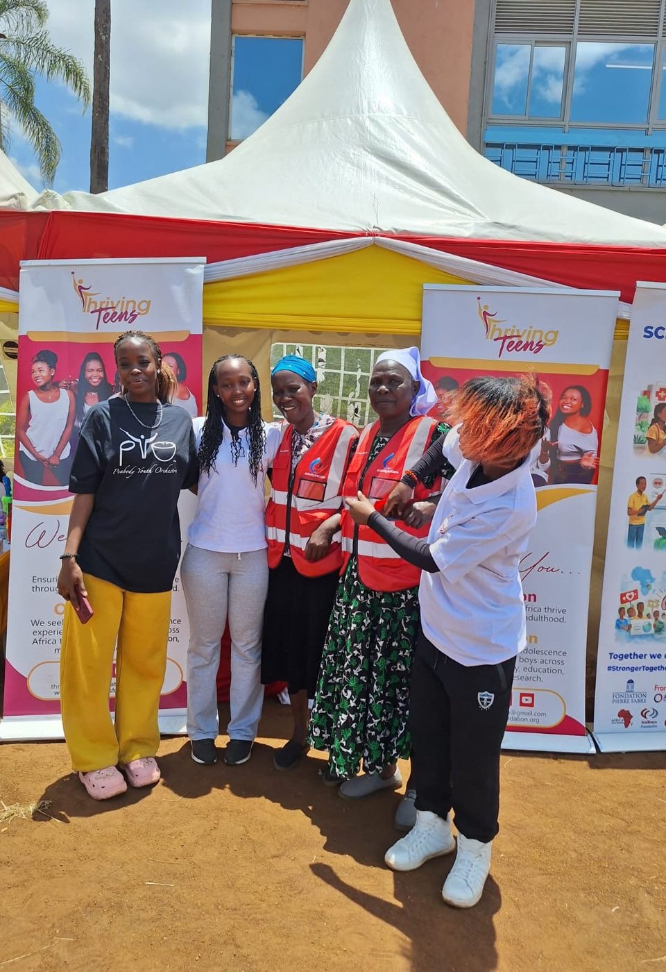 Thriving Teens Foundation team at a community outreach tent in Kenya