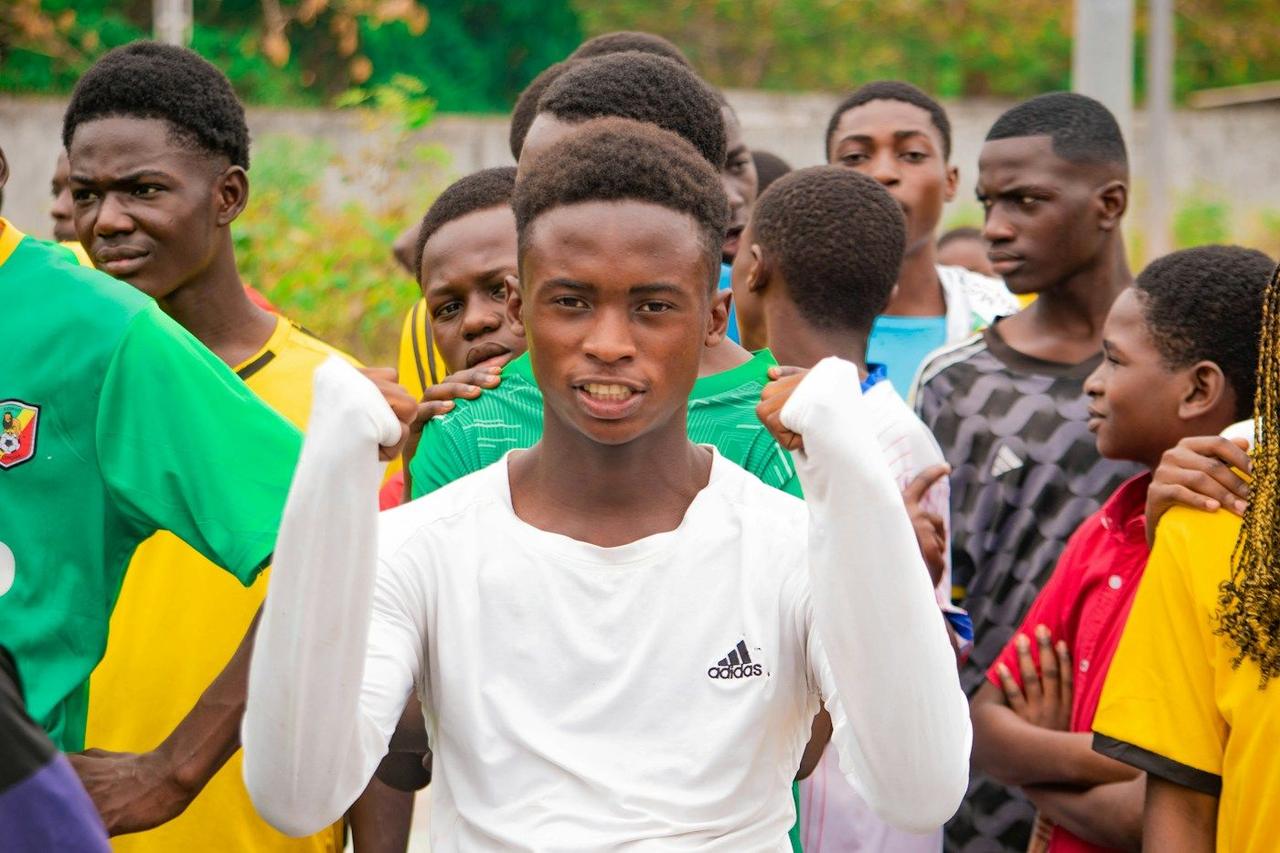 A young man celebrating with friends